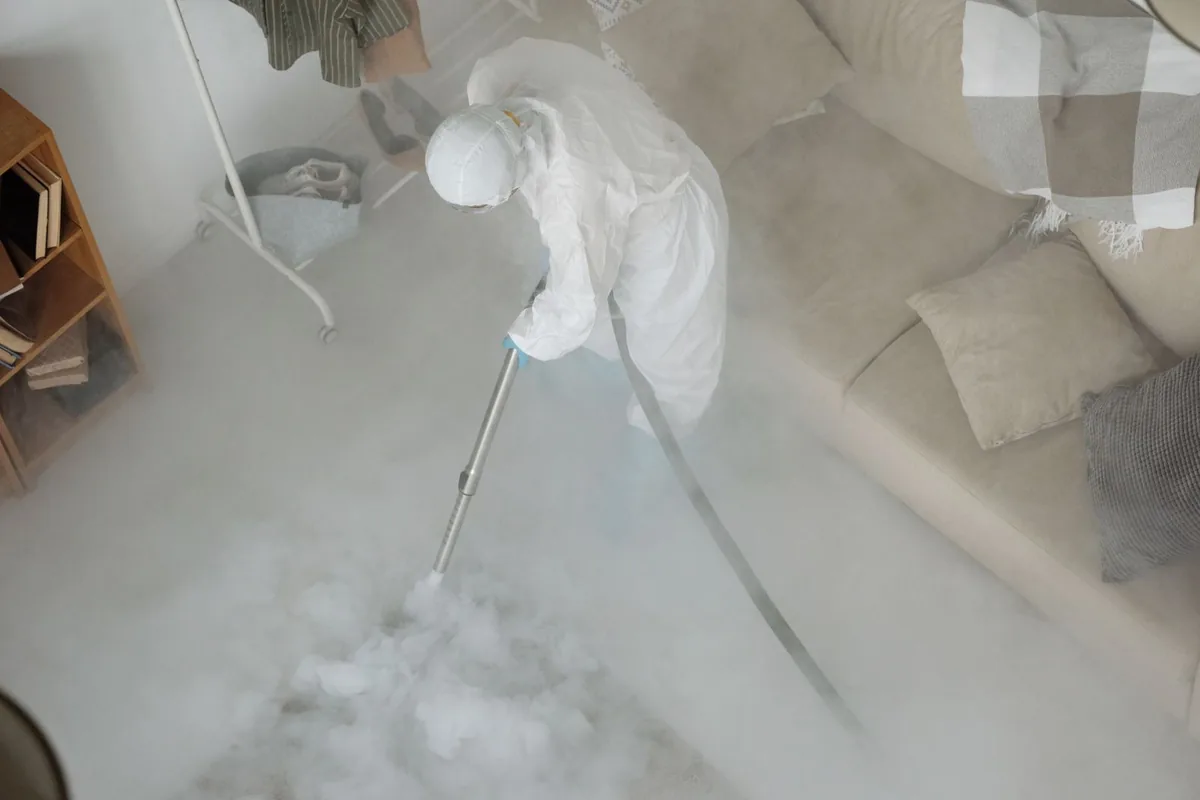 Biohazard cleanup technician in protective equipment, Springville, IA